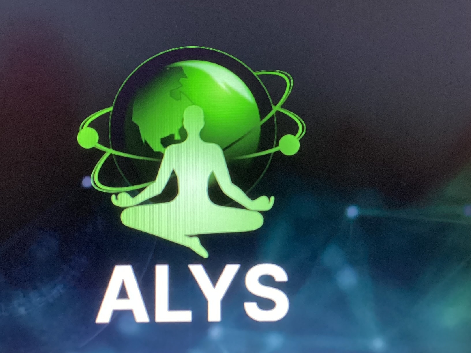 ALYS — Aliceaisystems logo featuring a glowing green meditating figure with orbital rings